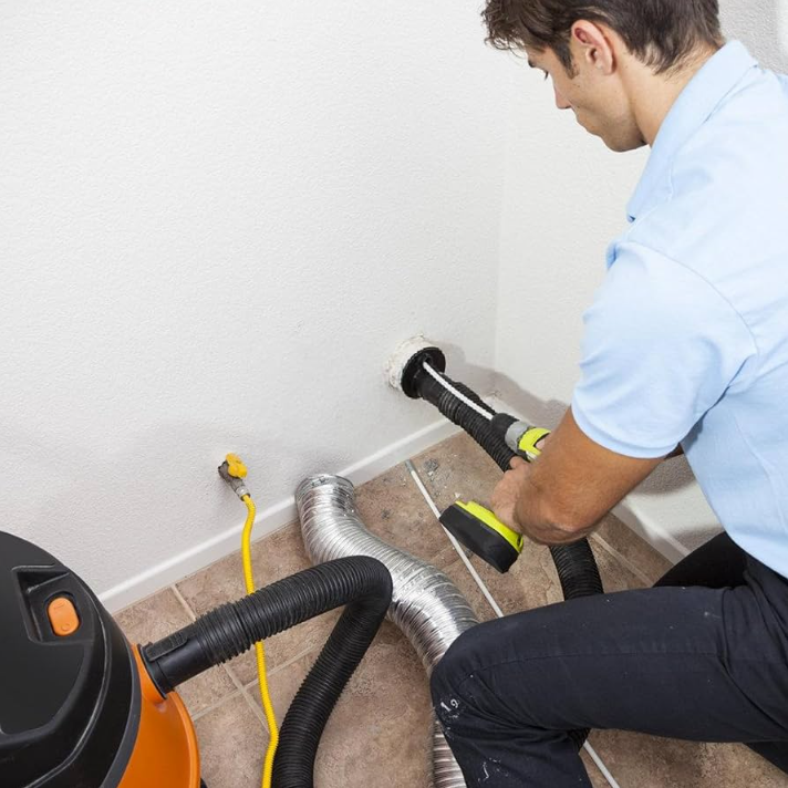 Service Technician Cleaning Dryer Vent